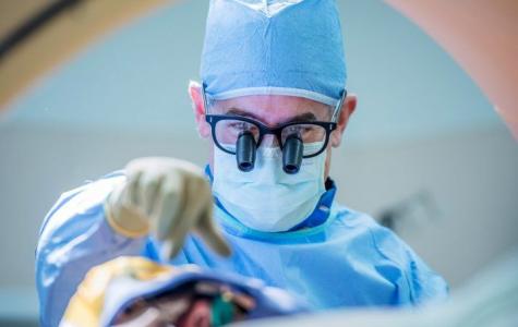 UCSF neurosurgeon Philip Starr performs brain surgery